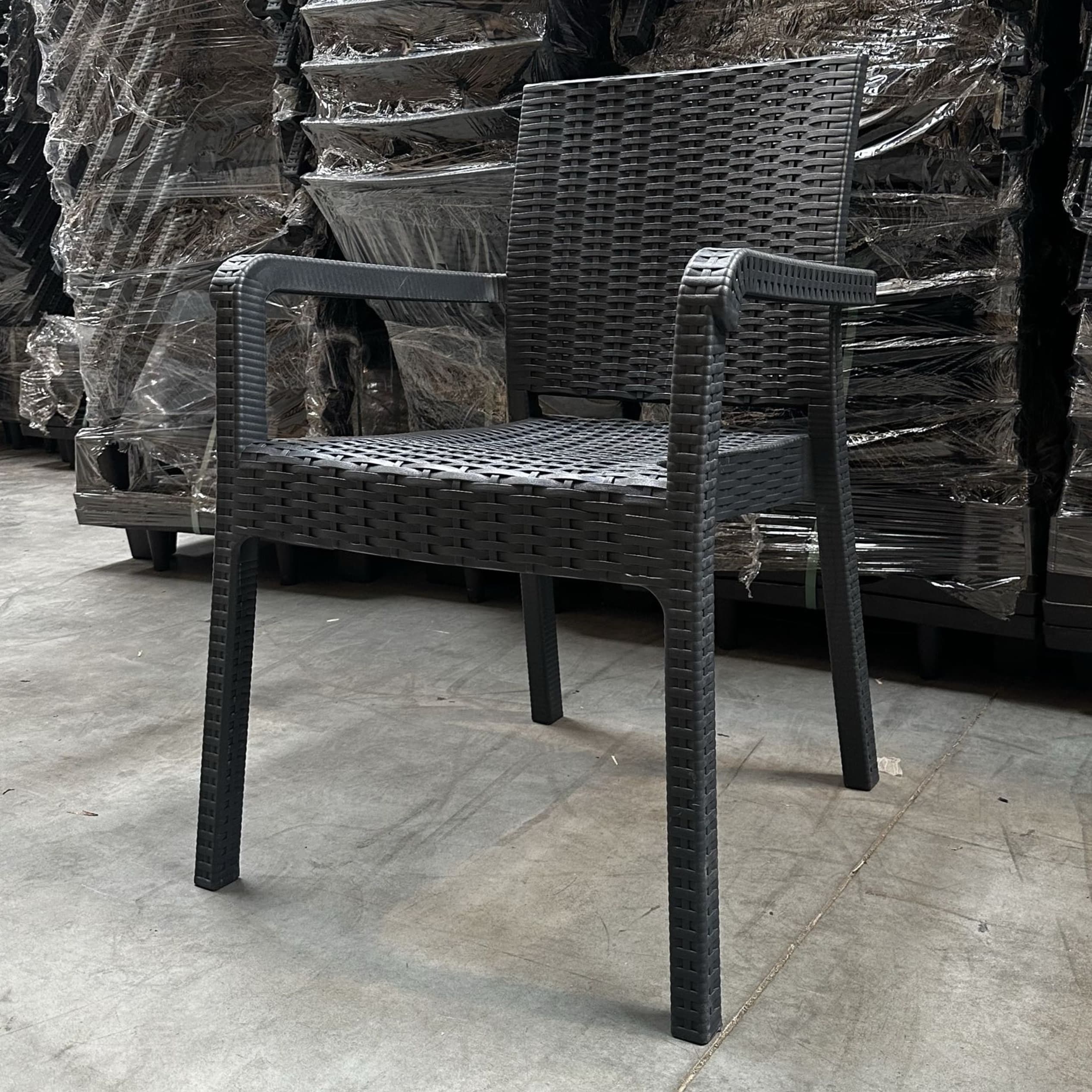 ALEZZO | Grey stackable outdoor terrace chair in woven‑look plastic – with armrests